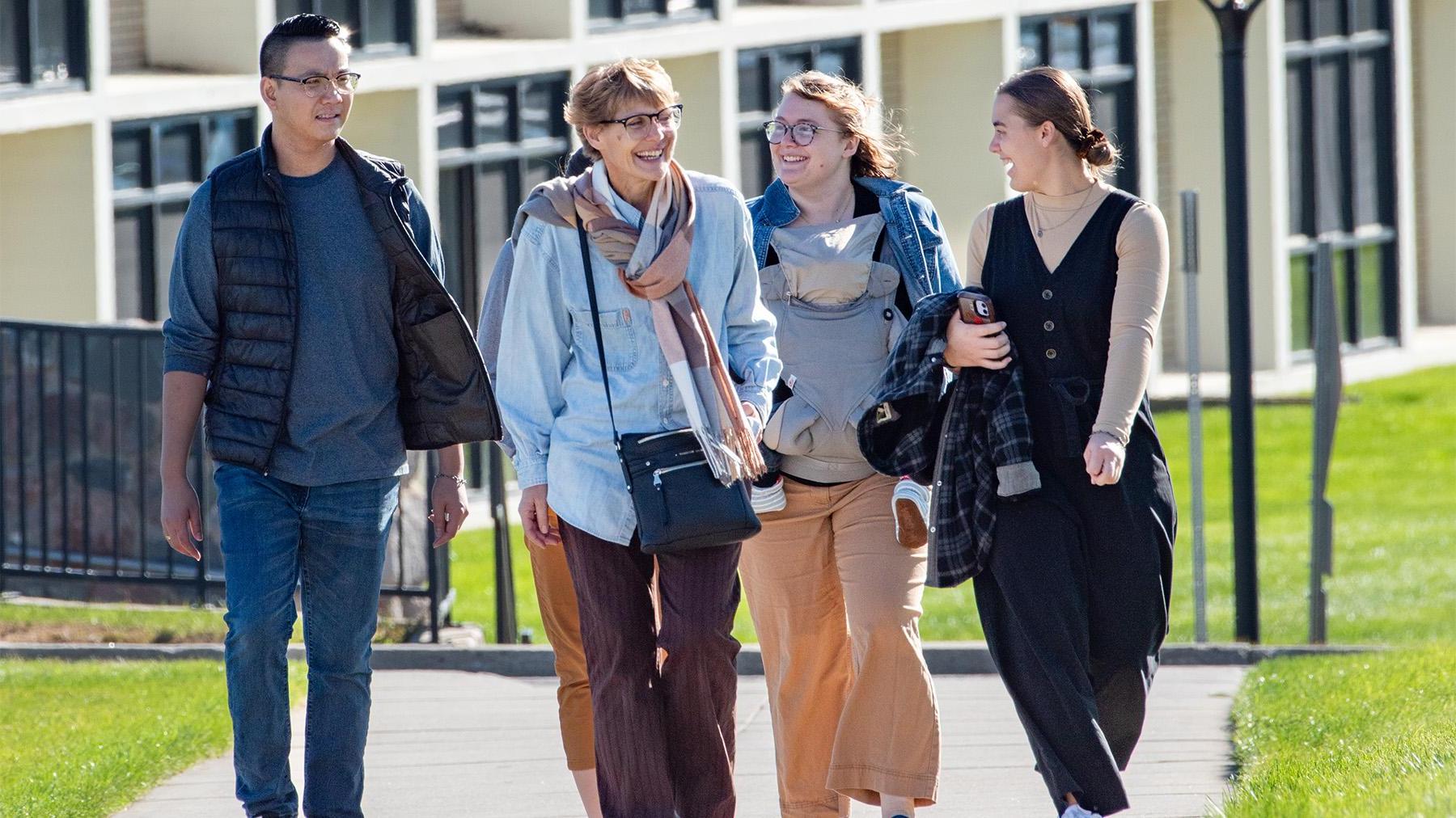 Parents getting a tour of the university of mary campus.